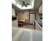 Cozy kitchen featuring a dining table, appliances, and ample cabinet space at 12920 Wedgewood Way # A, Hudson, FL 34667
