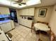 Bright kitchen featuring tile floors, ample counter space, and a dining area at 12920 Wedgewood Way # A, Hudson, FL 34667