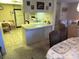 Open kitchen area with breakfast bar and adjacent dining space at 12920 Wedgewood Way # A, Hudson, FL 34667