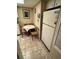 View of the kitchen showcasing a dining table, refrigerator, and tiled flooring at 12920 Wedgewood Way # A, Hudson, FL 34667