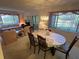 Open-concept layout combining the living and dining areas, filled with natural light at 12920 Wedgewood Way # A, Hudson, FL 34667