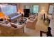 Cozy living room featuring plush furniture and natural light at 12920 Wedgewood Way # A, Hudson, FL 34667