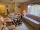 Comfortable living room with plush seating and views of the entrance at 12920 Wedgewood Way # A, Hudson, FL 34667
