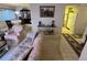 Open-concept living room leads to the kitchen with bright, clean finishes at 12920 Wedgewood Way # A, Hudson, FL 34667