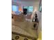 Comfortable living room with plush sofas, side tables, and sliding door access at 12920 Wedgewood Way # A, Hudson, FL 34667