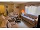 Inviting living room features comfortable furniture and neutral color palette at 12920 Wedgewood Way # A, Hudson, FL 34667