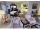 Open-concept living, dining, and kitchen with modern decor and neutral tones at 12920 Wedgewood Way # A, Hudson, FL 34667