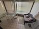 Bright sun room features a dining table with chairs and a cushioned wicker sofa at 12920 Wedgewood Way # A, Hudson, FL 34667