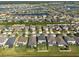 Lovely aerial view showcases a neighborhood with houses surrounding sparkling lakes and lush greenery at 13639 Ashlar Slate Pl, Riverview, FL 33579