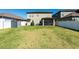 Expansive backyard showcasing a privacy fence, a storage shed and a screened lanai at 13639 Ashlar Slate Pl, Riverview, FL 33579