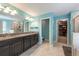 Modern bathroom featuring a double vanity, granite counters, walk-in shower, and a separate room for the toilet at 13639 Ashlar Slate Pl, Riverview, FL 33579