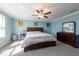 Bright bedroom featuring a cozy bed, carpeted floors, and a dark wooden dresser beneath a vanity mirror at 13639 Ashlar Slate Pl, Riverview, FL 33579