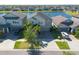 Beautiful two-story home with lush landscaping and a picturesque lake view in a desirable neighborhood at 13639 Ashlar Slate Pl, Riverview, FL 33579