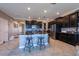 Stylish kitchen featuring dark cabinets, granite countertops, stainless steel appliances and lots of space at 13639 Ashlar Slate Pl, Riverview, FL 33579