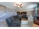 Inviting living space featuring tile floors, large sofa, ceiling fan, and a cozy atmosphere at 13639 Ashlar Slate Pl, Riverview, FL 33579
