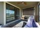 Relaxing screened-in patio with a hammock and view of the backyard and serene water at 13639 Ashlar Slate Pl, Riverview, FL 33579