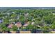 Aerial view showing the property's location amidst a neighborhood rich with mature trees and landscaping at 1518 Rolling Meadow Dr, Valrico, FL 33594