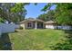 Well-maintained backyard featuring lush green grass and a freshly painted fence at 1518 Rolling Meadow Dr, Valrico, FL 33594