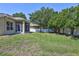 Expansive backyard featuring a screened lanai and a well-maintained lawn at 1518 Rolling Meadow Dr, Valrico, FL 33594