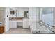 Bright primary bathroom featuring dual sinks, a soaking tub, and a large glass enclosed shower at 1518 Rolling Meadow Dr, Valrico, FL 33594