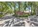 Welcoming entrance to the Meadow Woods Reserve community with lush landscaping at 1518 Rolling Meadow Dr, Valrico, FL 33594