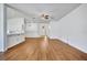 Bright living area features an open floor plan, wood flooring, and views of the front door at 1518 Rolling Meadow Dr, Valrico, FL 33594