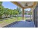 Screened in patio showcasing the beautiful green backyard and landscaping at 1518 Rolling Meadow Dr, Valrico, FL 33594