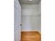 This walk-in closet has wooden floors and wire shelves for ample storage space at 1518 Rolling Meadow Dr, Valrico, FL 33594