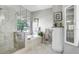 Bright bathroom featuring a tiled shower, soaking tub, and decorative fixtures at 16118 Lytham Dr, Odessa, FL 33556