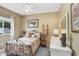 Comfortable bedroom with carpeting, a metal bed frame, and soft, neutral decor at 16118 Lytham Dr, Odessa, FL 33556