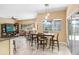 Bright dining area that opens to an outdoor patio, perfect for casual dining at 16118 Lytham Dr, Odessa, FL 33556