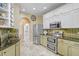 Well-equipped kitchen with stainless steel appliances and ample cabinet space at 16118 Lytham Dr, Odessa, FL 33556