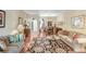 The beautiful living room features stylish furnishings, wood floors, and an open layout at 16118 Lytham Dr, Odessa, FL 33556