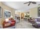 Bright living room open to kitchen and dining area with large windows and neutral color palette at 16118 Lytham Dr, Odessa, FL 33556