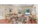 The beautiful living room features stylish furnishings, wood floors, and an open layout at 16118 Lytham Dr, Odessa, FL 33556