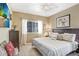 Cozy main bedroom with serene decor, natural light, and calming beach-themed artwork at 16118 Lytham Dr, Odessa, FL 33556