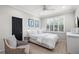 Bedroom with shuttered window, neutral color scheme, and hardwood floors at 16629 Sedona De Avila, Tampa, FL 33613
