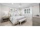 Bedroom featuring a bed with patterned bedding and a bench at the foot of it at 16629 Sedona De Avila, Tampa, FL 33613