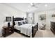 Bedroom with a dark wood frame bed, soft lighting, and elegant decor at 16629 Sedona De Avila, Tampa, FL 33613