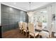 Dining room features a chandelier, paneled walls, and an oversized window at 16629 Sedona De Avila, Tampa, FL 33613