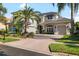 Beautiful two-story home with a brick driveway, lush landscaping, and a two-car garage at 16629 Sedona De Avila, Tampa, FL 33613