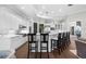Bright kitchen with breakfast bar seating, white cabinetry, stainless appliances, and modern fixtures at 16629 Sedona De Avila, Tampa, FL 33613