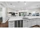 Bright and open kitchen featuring white cabinetry, stainless appliances and breakfast bar seating at 16629 Sedona De Avila, Tampa, FL 33613