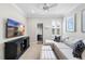 Comfortable living room with sectional sofa, modern TV, and neutral tones at 16629 Sedona De Avila, Tampa, FL 33613