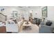 Living room featuring neutral furniture, wood floors, and soft lighting at 16629 Sedona De Avila, Tampa, FL 33613