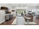 Bright living room featuring hardwood floors, neutral decor and direct access to outdoor patio at 16629 Sedona De Avila, Tampa, FL 33613