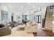 Open living area with wood floors, neutral furniture, and natural lighting at 16629 Sedona De Avila, Tampa, FL 33613