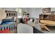 Comfortable bedroom with bunk beds, sofa, and modern decor at 17583 Holly Well Ave, Wimauma, FL 33598