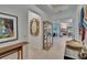 Open foyer with sight lines into the living spaces, featuring tile flooring at 17583 Holly Well Ave, Wimauma, FL 33598