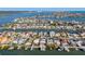 A coastal canal community with a multitude of homes with private docks and boatlifts, and bay access at 17730 Long Point Dr, Redington Shores, FL 33708